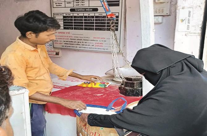 A consumer is being given special ration kit items. (Photo: inquilab)